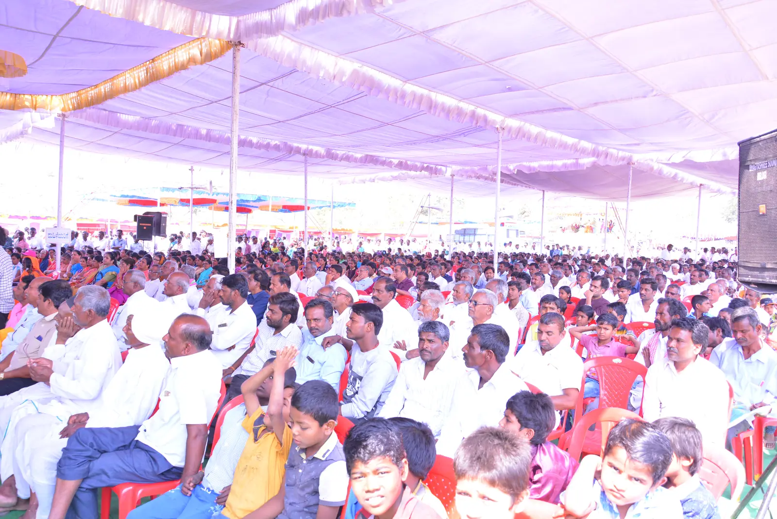 Hundreds of villagers seated under the camp pandal at a free health camp in Shahapur