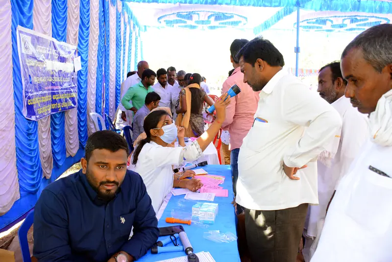 Villagers registering at the camp desk before consultation